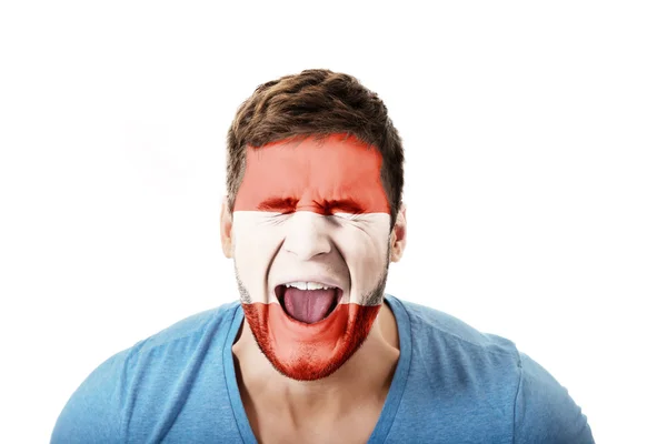 Homem gritando com a bandeira da Áustria na cara . — Fotografia de Stock