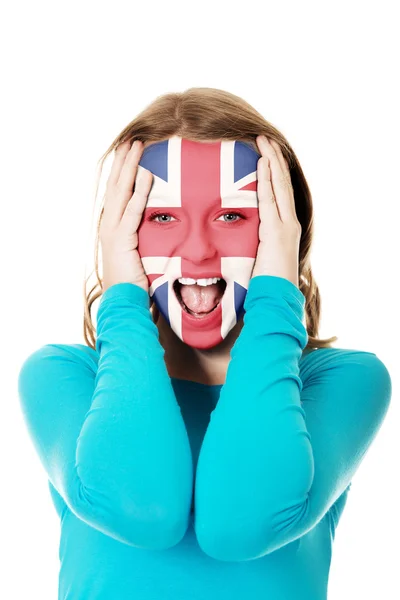 Mulher com bandeira da Grã-Bretanha no rosto . — Fotografia de Stock