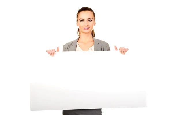 Business woman presenting empty banner. — Stock Photo, Image