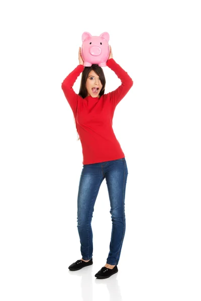 Happy young woman with piggybank. — Stock Photo, Image