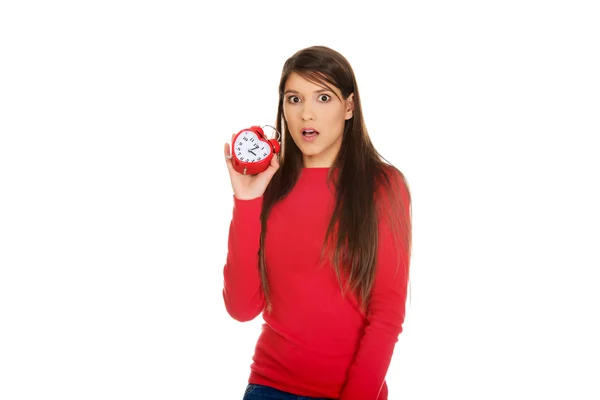 Shocked woman with alarm clock. — Stock Photo, Image