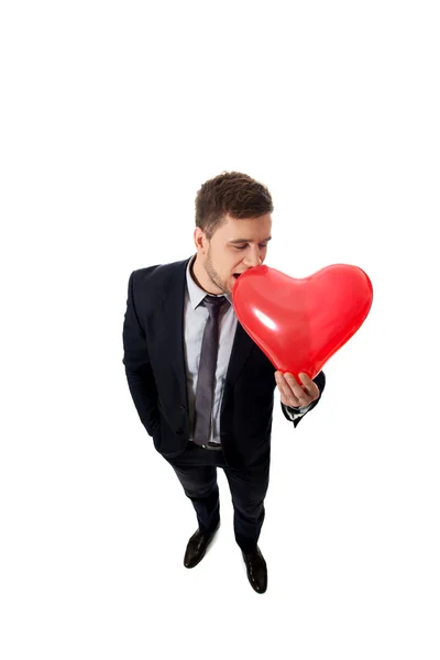 Empresario con globo en forma de corazón . — Foto de Stock