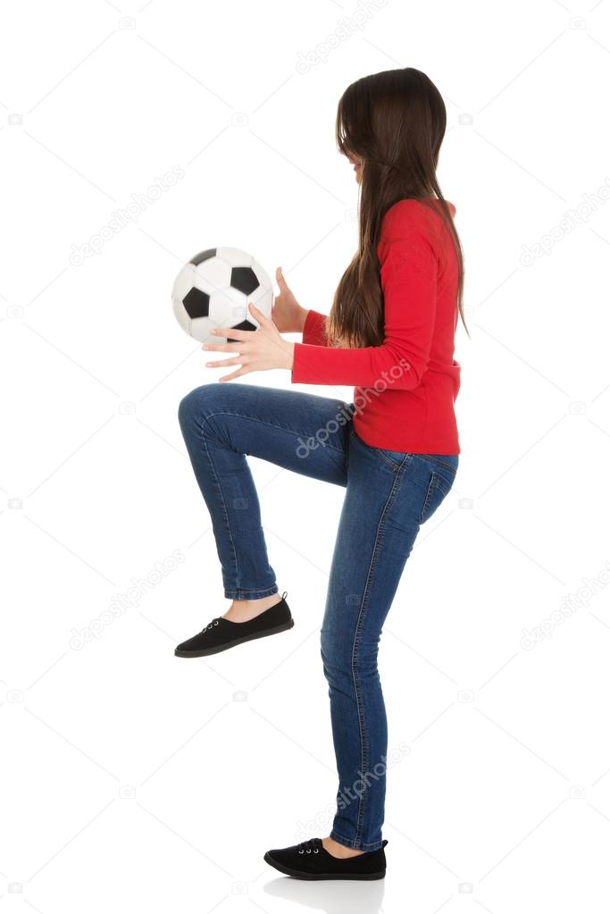 Woman with a soccer ball.