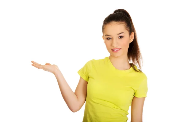 Woman holding something on palm. — Stock Photo, Image