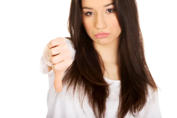 Unhappy woman with thumb down. — Stock Photo, Image