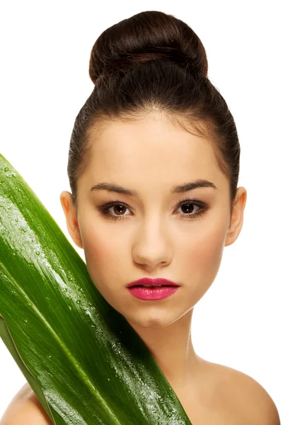Beautiful woman with green leaf. — Stock Photo, Image
