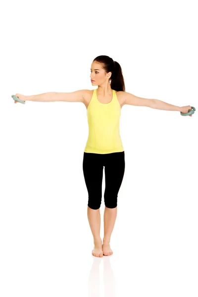 Active woman holding weights. — Stock Photo, Image