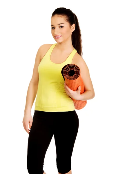 Fitness kadın yoga mat holding hazır. — Stok fotoğraf