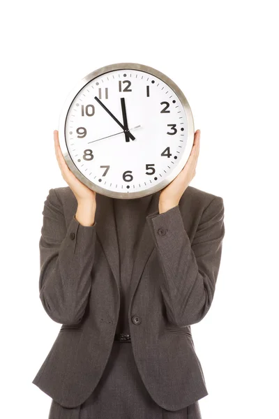 Woman covering face with clock. — Stock Photo, Image