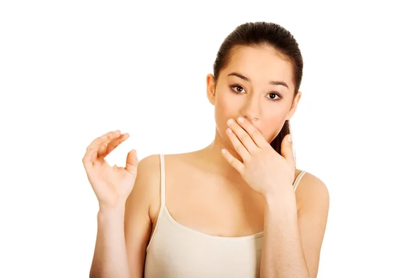 Shocked woman with pregnancy test. Stock Picture