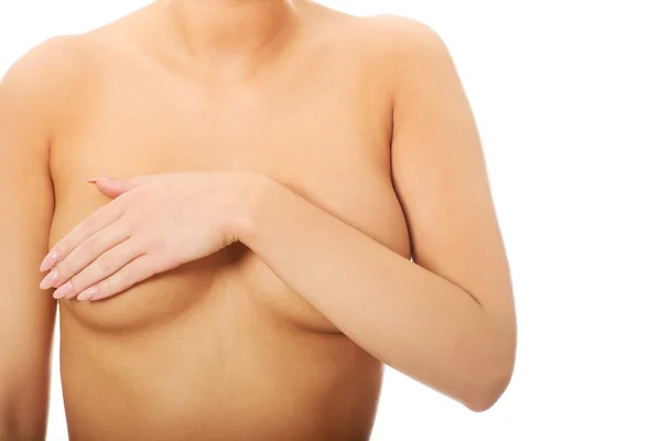 Woman covering her breast. — Stock Photo, Image