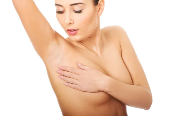 Frau untersucht Brust. — Stockfoto