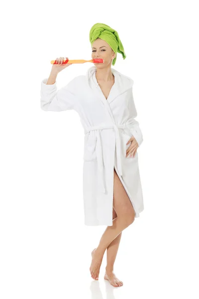 Woman with oversized toothbrush. — Stock Photo, Image