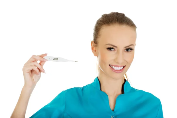 Attractive doctor with a thermometer. — Stock Photo, Image