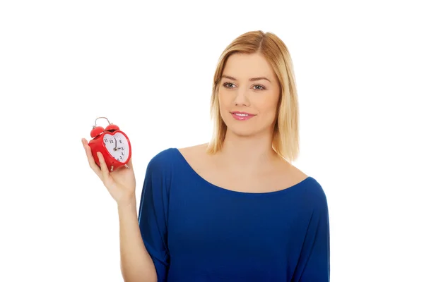 Woman with a clock. — Stock Photo, Image