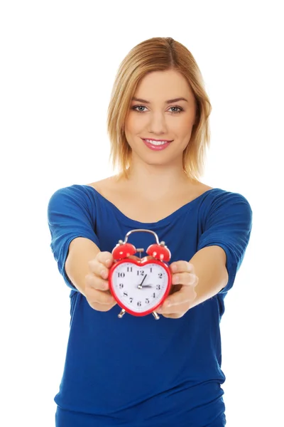 Woman with a clock. — Stock Photo, Image
