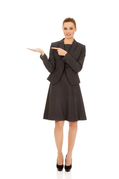 Businesswoman pointing on hand. — Stock Photo, Image