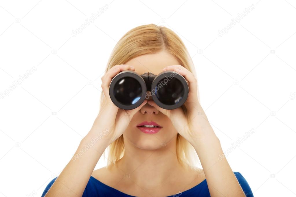 Young woman with binoculars.