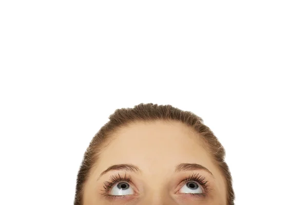 Young womans eyes looking up. — Stock Photo, Image