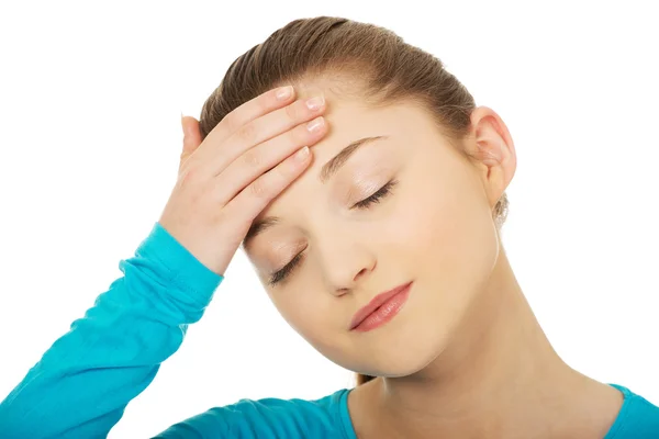 Tonåring kvinna med huvudvärk. — Stockfoto