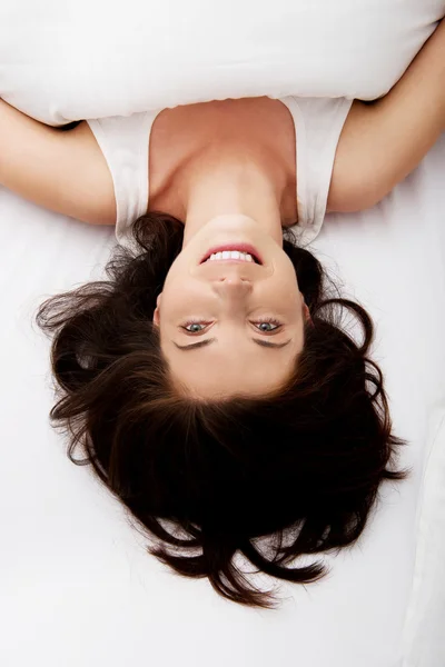 Happy woman lying in bed. — Stock Photo, Image