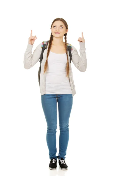 Schoolgirl pointing up. — Stock Photo, Image