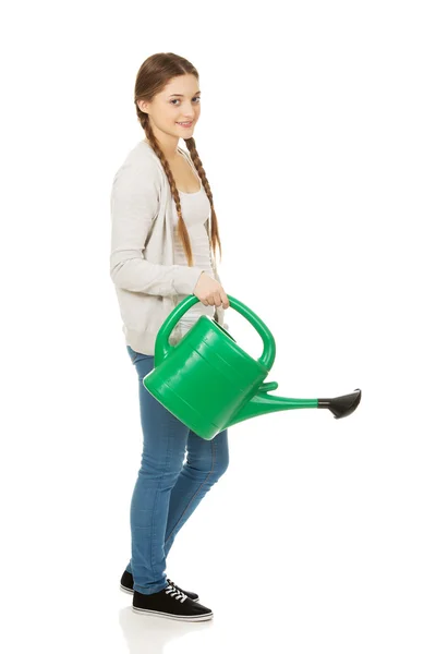 Teen woman with watering can. — Stock Photo, Image