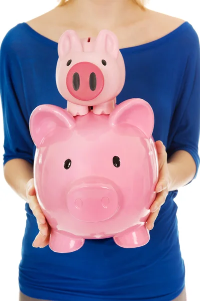 Woman with piggybanks. — Stock Photo, Image