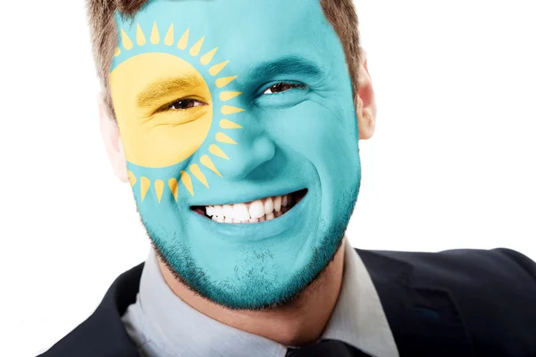 Happy man with Kazakhstan flag on face. — Stock Photo, Image