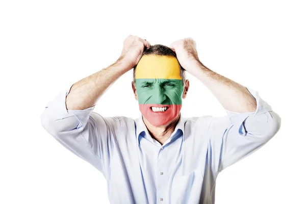 Mature man with Lithuania flag on face. — Stock Photo, Image