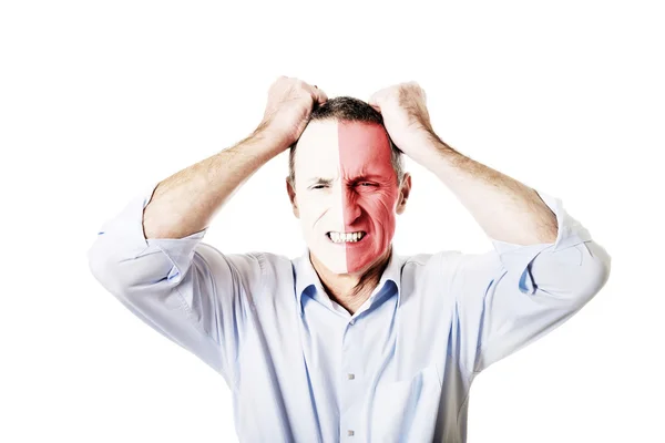 Mature man with Malta flag on face. — Stock Photo, Image