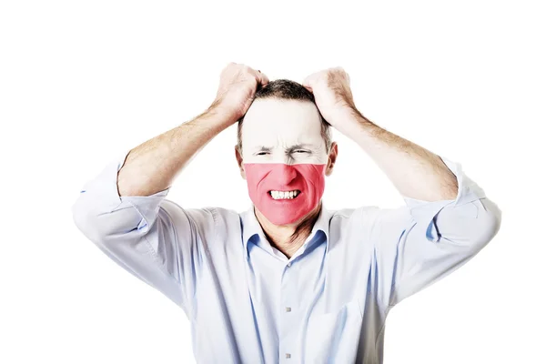 Mature man with Poland flag on face. — Stock Photo, Image