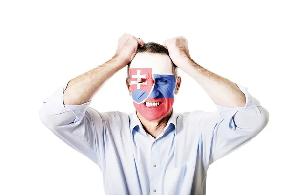 Mature man with Slovakia flag on face. — Stock Photo, Image