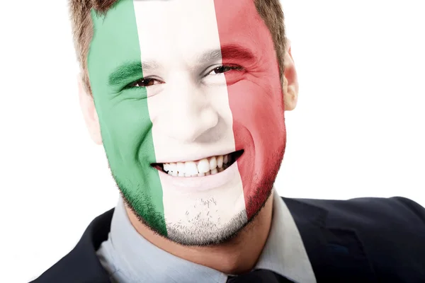 Homem feliz com a bandeira da Itália no rosto . — Fotografia de Stock