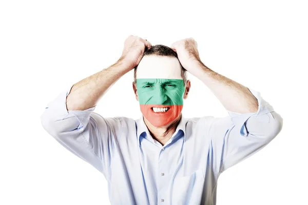 Mature man with Bulgaria flag on face. — Stock Photo, Image