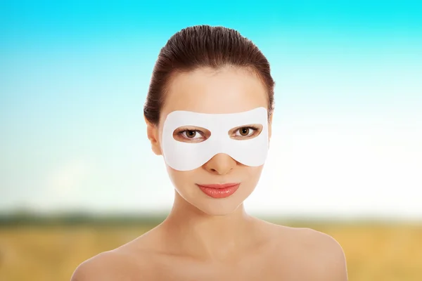 Beautiful woman with collagen mask. — Stock Photo, Image