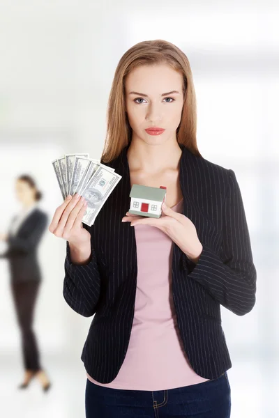 Business woman with house and dollars. — Stock Photo, Image