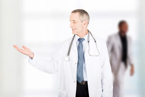 Doctor with open hand. — Stock Photo, Image
