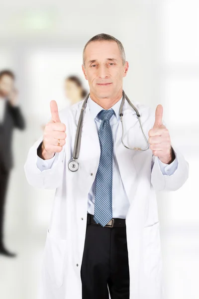 Doctor with thumbs up . — стоковое фото