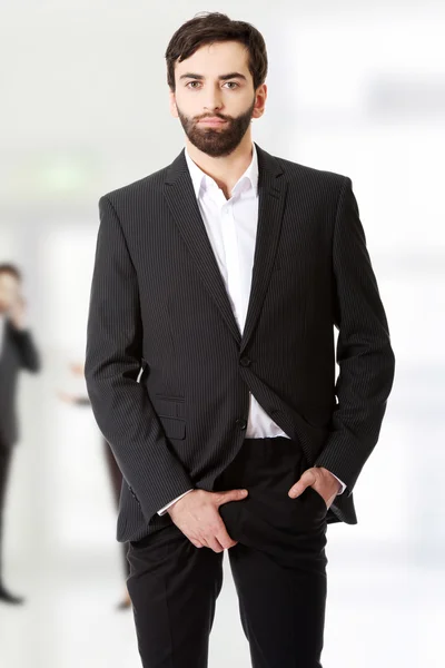 Businessman holding his crotch. — Stock Photo, Image