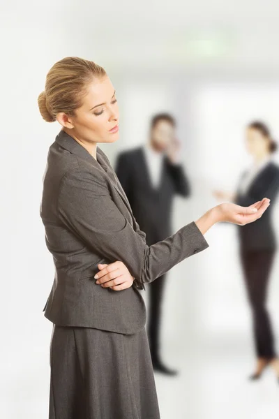 Businesswoman showing empty hand. — Stock Photo, Image