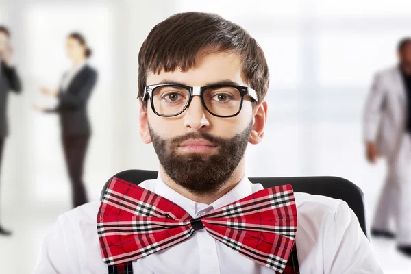 Young old fashioned man sitting on armchair. — Stock Photo, Image