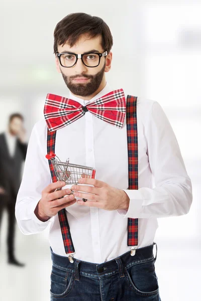 Man in suspenders with small shopping basket. — Stock Photo, Image