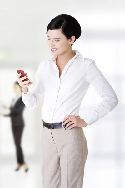 Businesswoman sending sms. — Stock Photo, Image