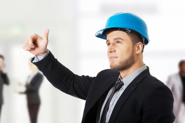 Happy businessman in helmet whit thumbs up. — Stock Photo, Image