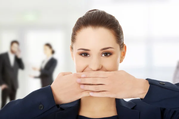 Mujer de negocios cubriendo con la mano su boca . —  Fotos de Stock