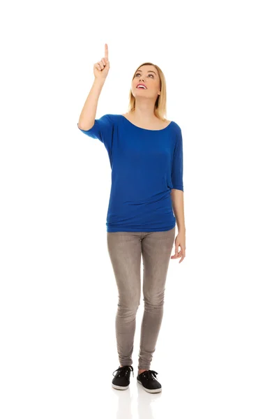 Beautiful woman pointing up. — Stock Photo, Image