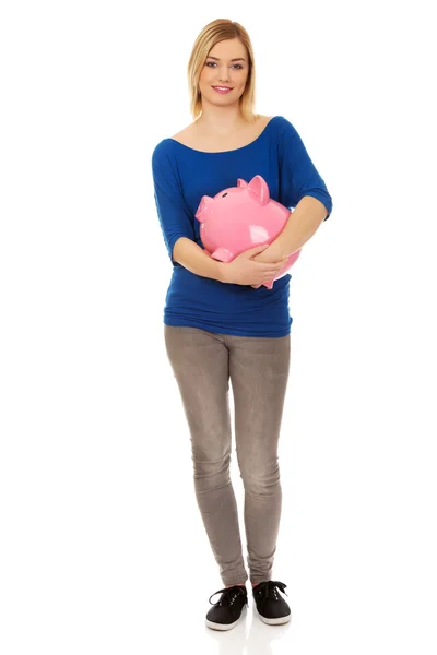 Happy woman holding piggybank. — Stock Photo, Image