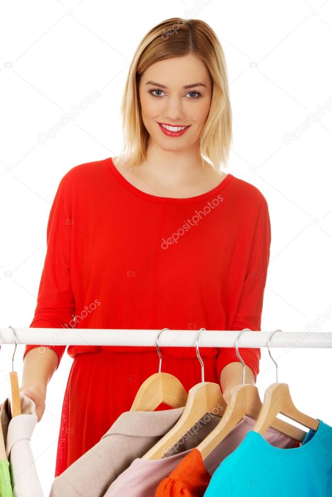 Woman deciding what to put on.
