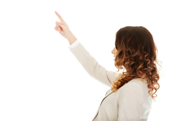 Mujer de negocios señalando hacia arriba . — Foto de Stock